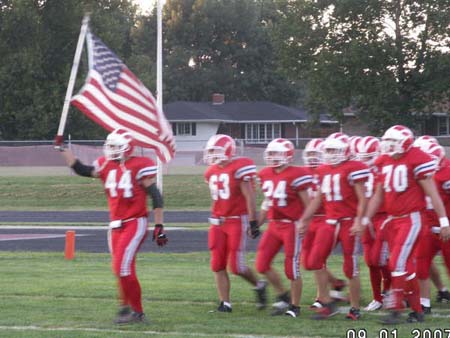 The Mustangs came out under the American flag that had flown over Iraq 